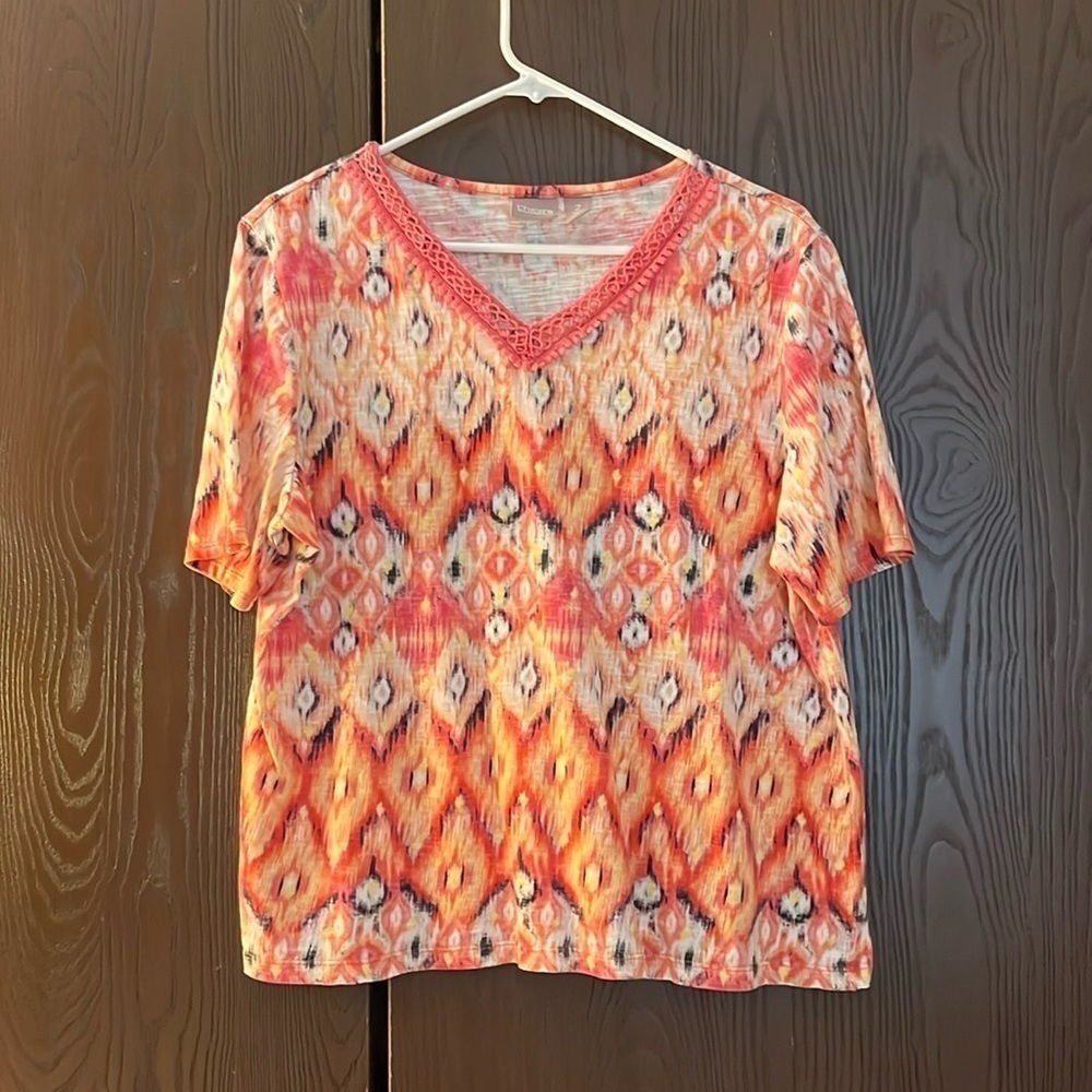 Chico’s pink/ black/ yellow and red patterned, short sleeved top. Size Chico 2